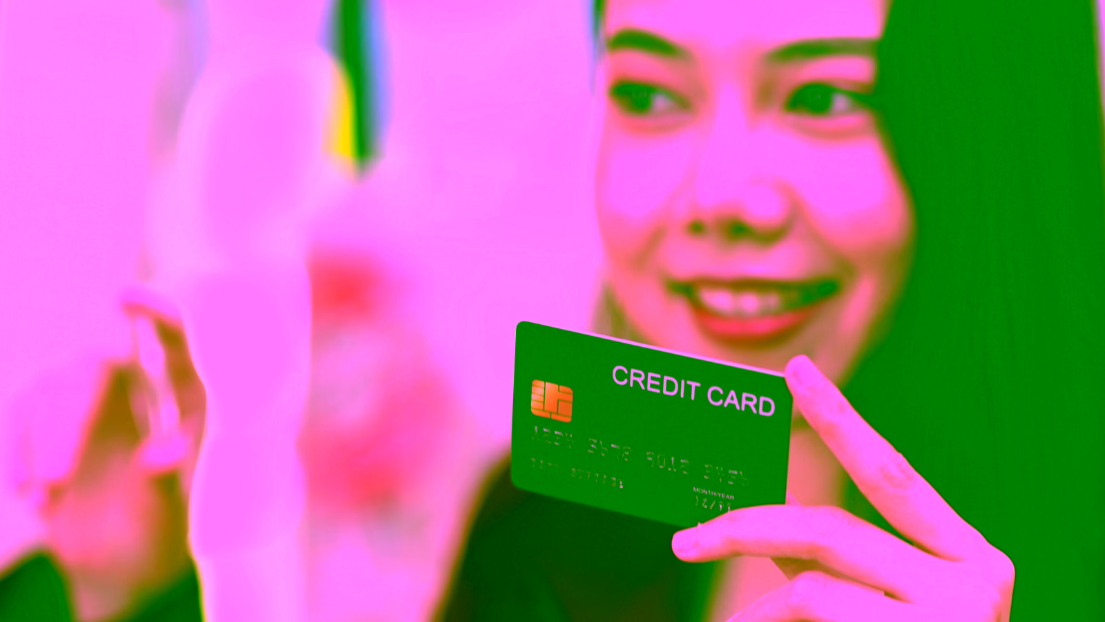 woman holding credit card
