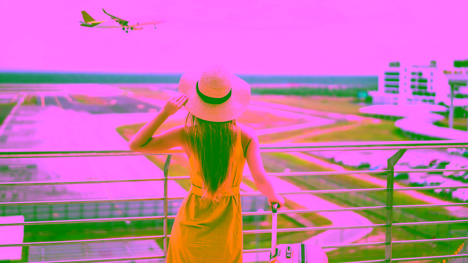 Woman watching airplane at airport