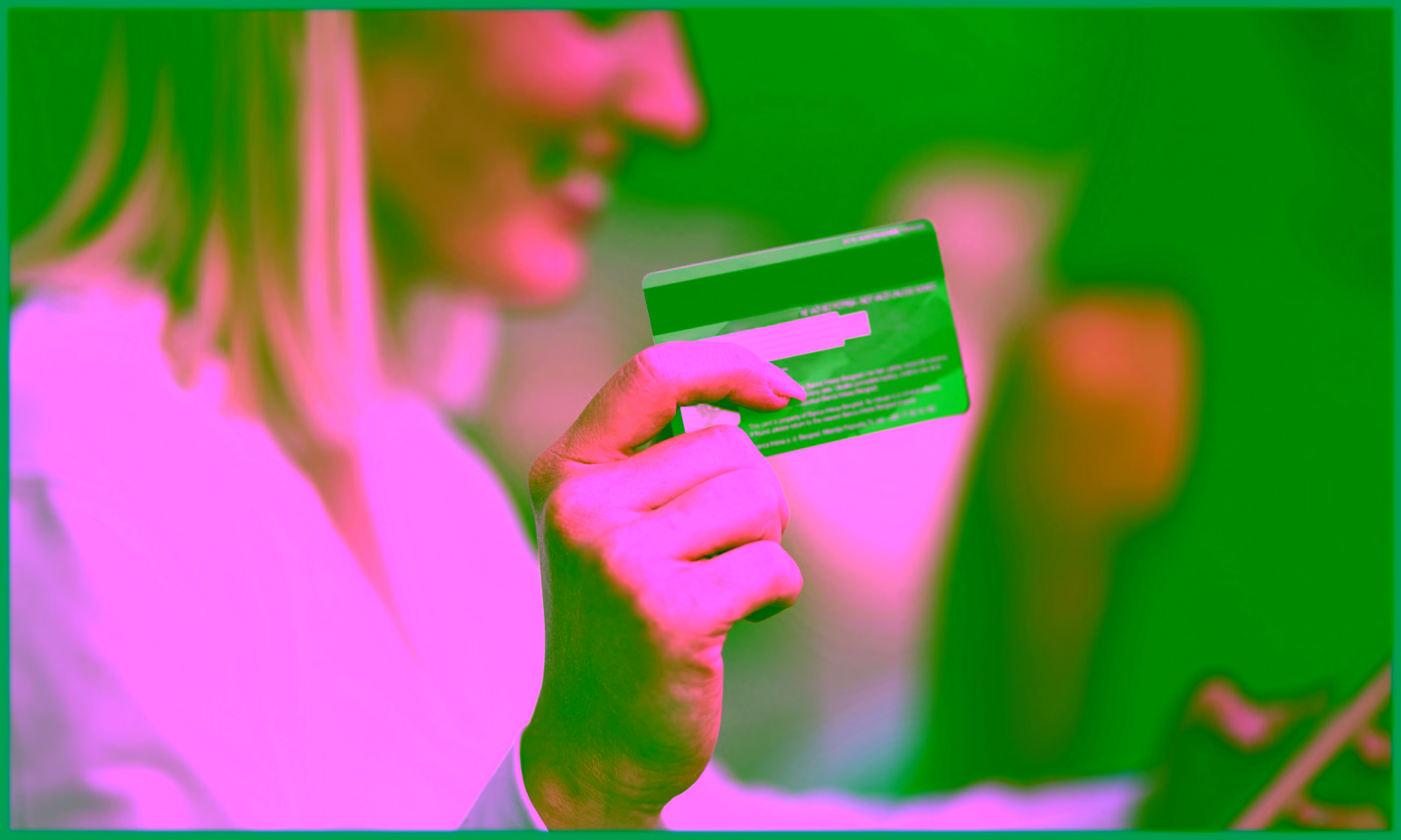 girl holding a credit card and an iphone