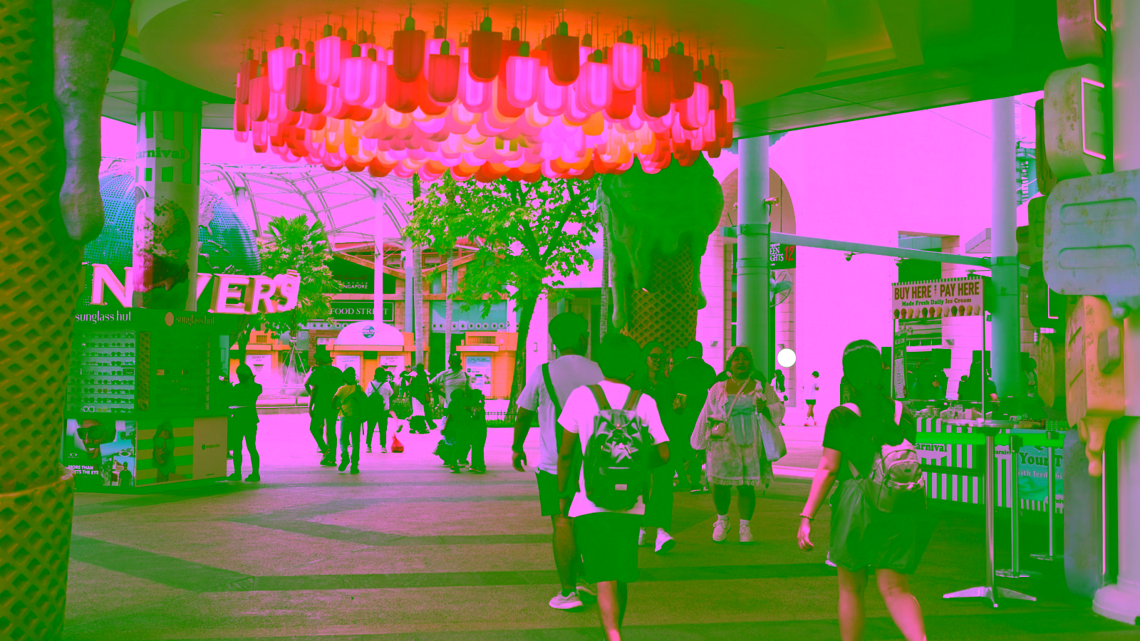 Visitors strolling through a vibrant outdoor shopping area