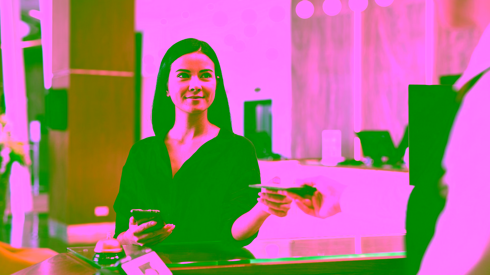 Woman handing passport at reception desk
