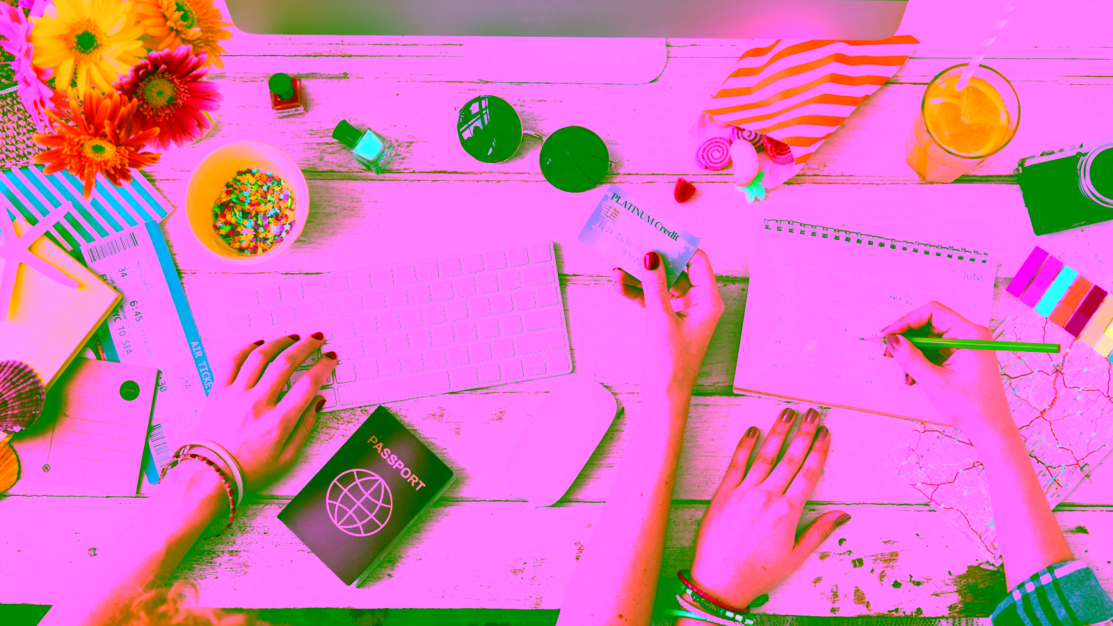 Travel planning with credit card, passport, and calendar.