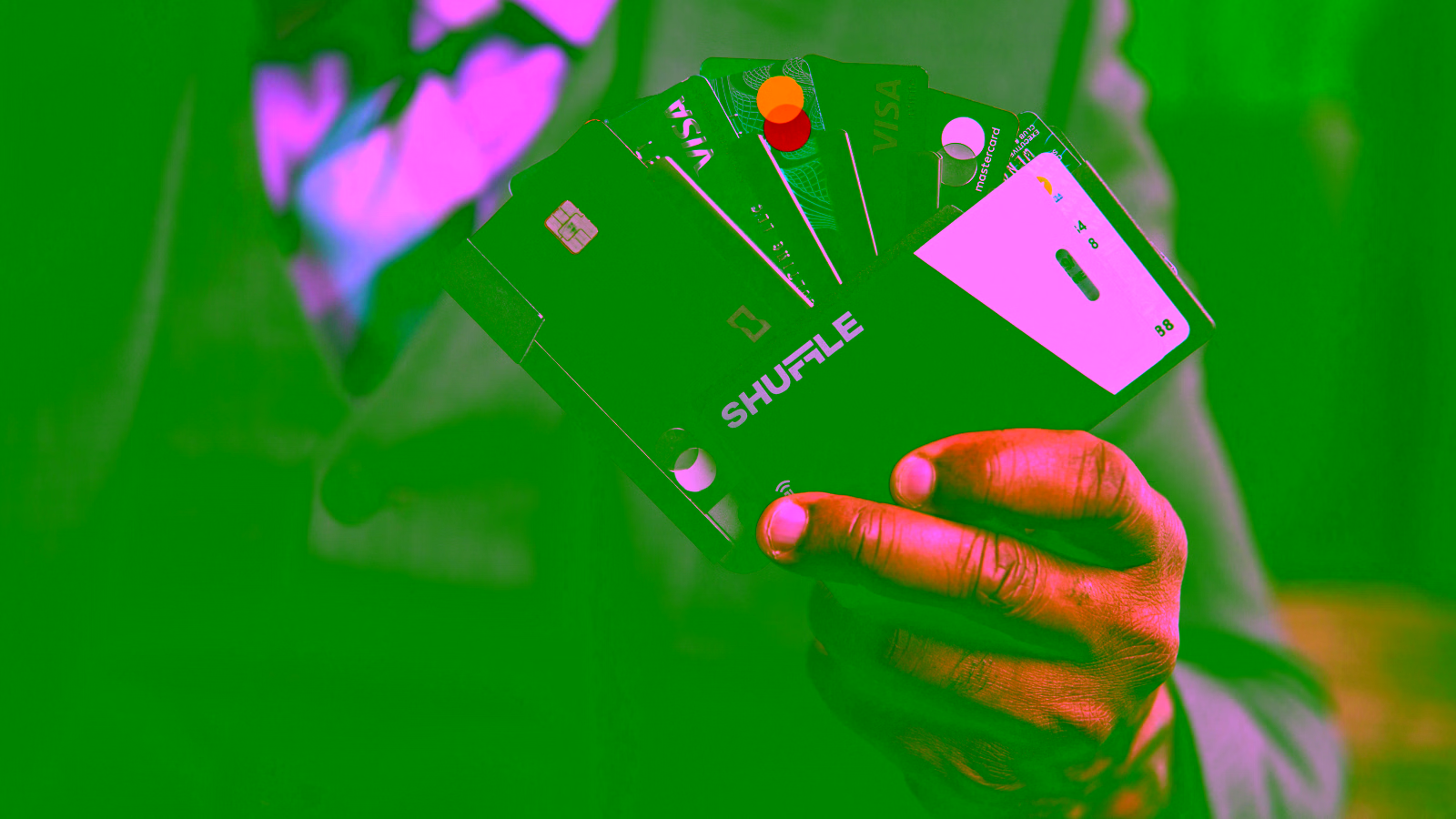 Man holding multiple credit cards