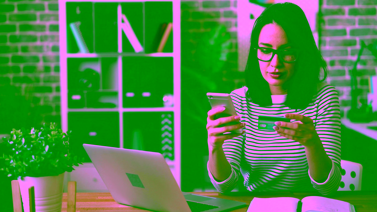 Woman using phone and credit card