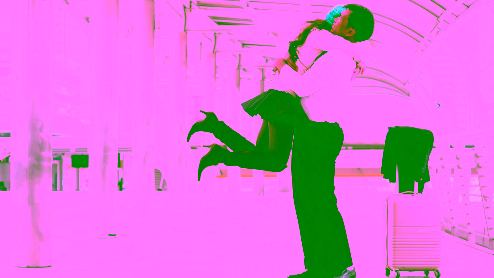 Couple hugging at airport