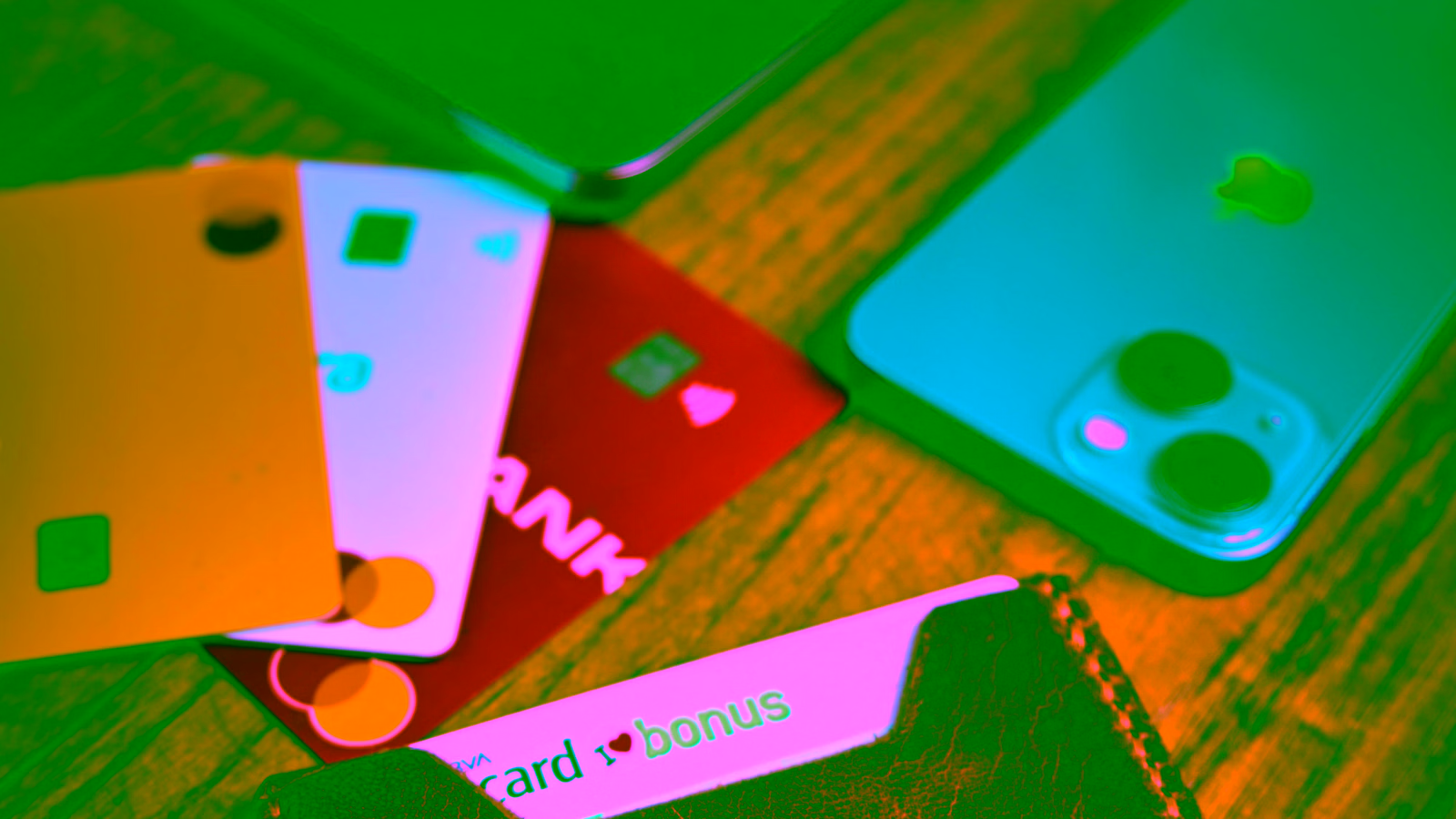 Credit cards on a table with a smartphone and wallet