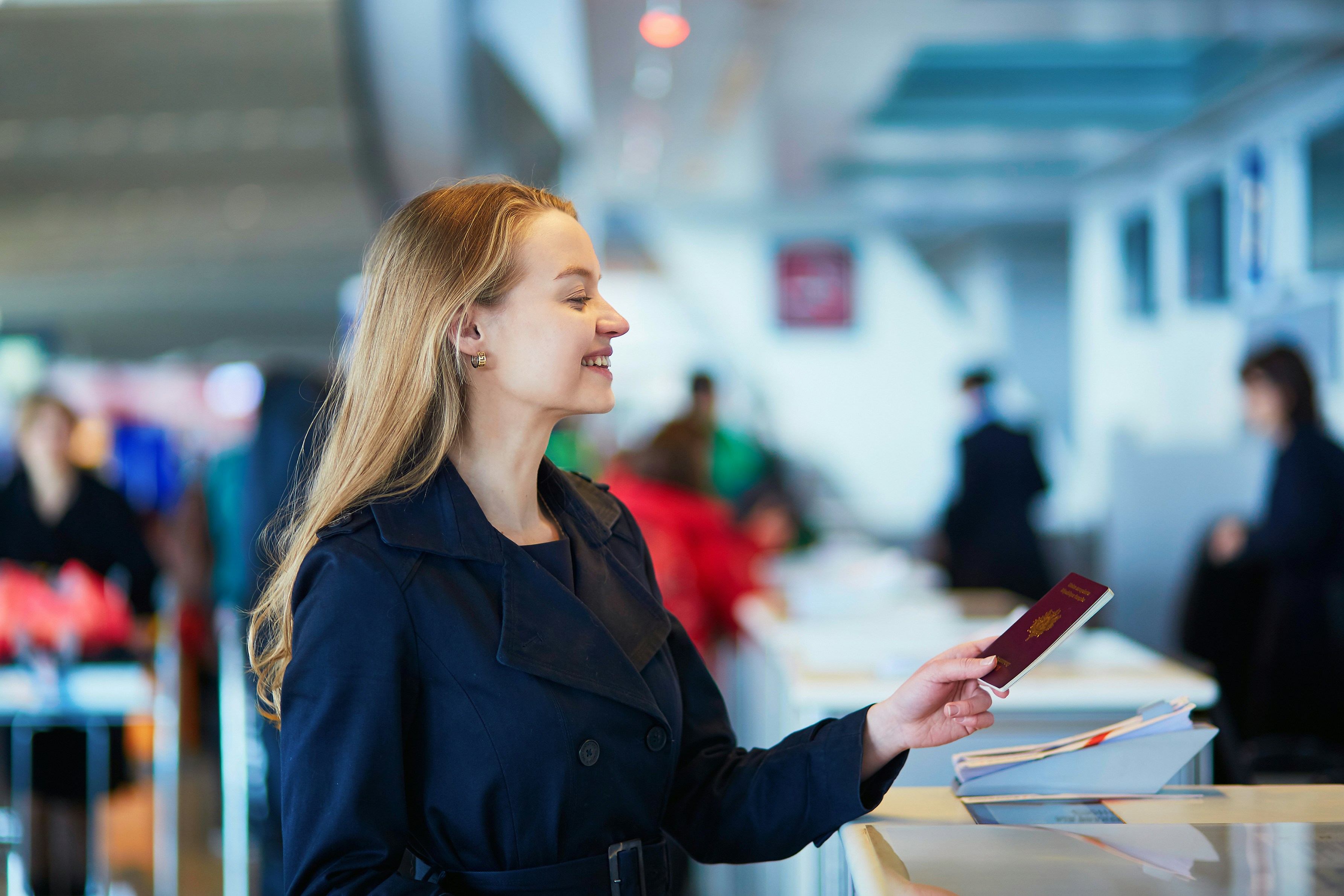 Traveler holding a passport at an airport