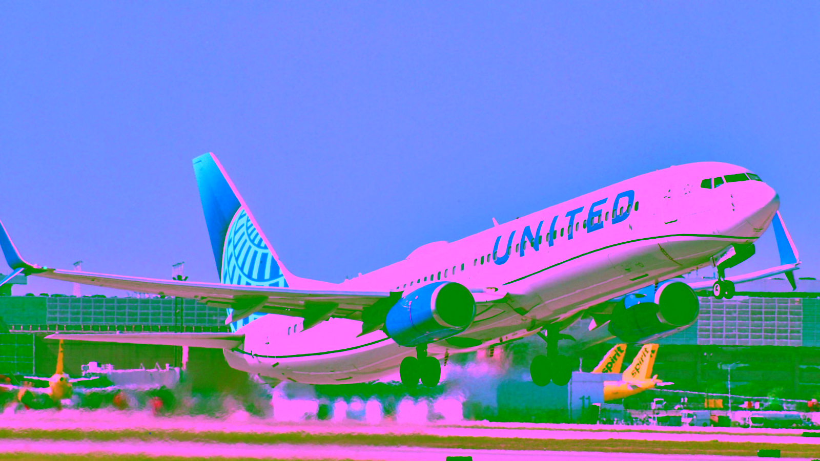 United Airlines plane taking off from airport runway