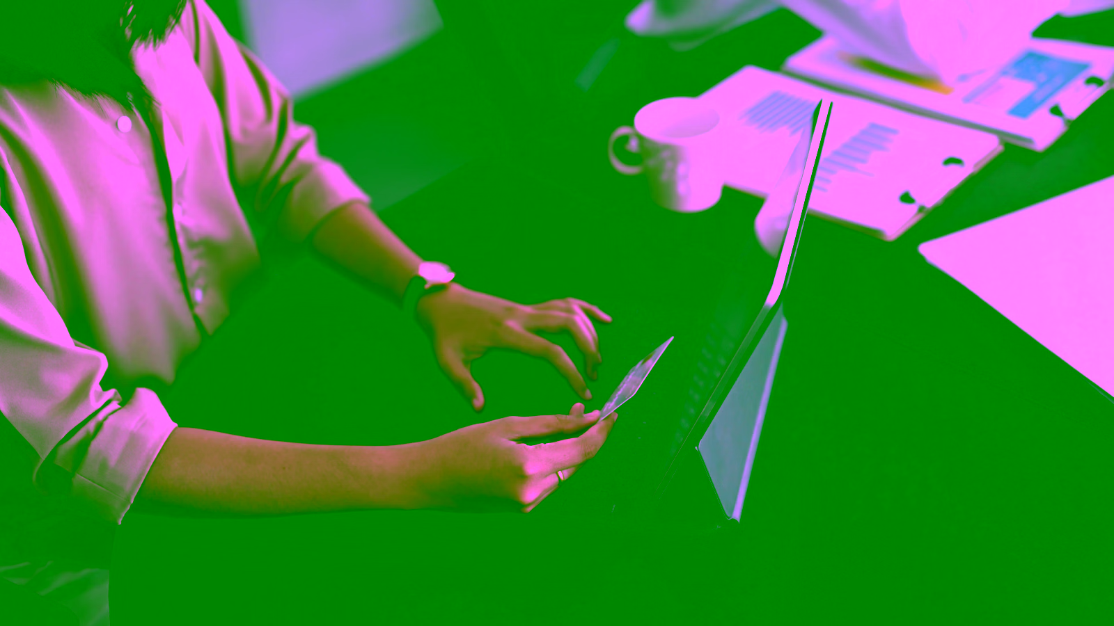 Woman using credit card on laptop
