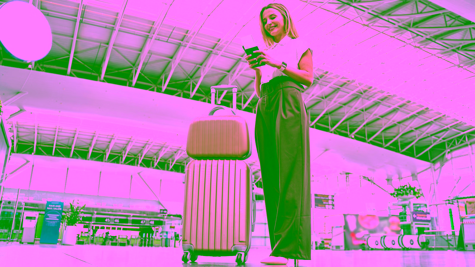 Traveler checking flight changes at airport