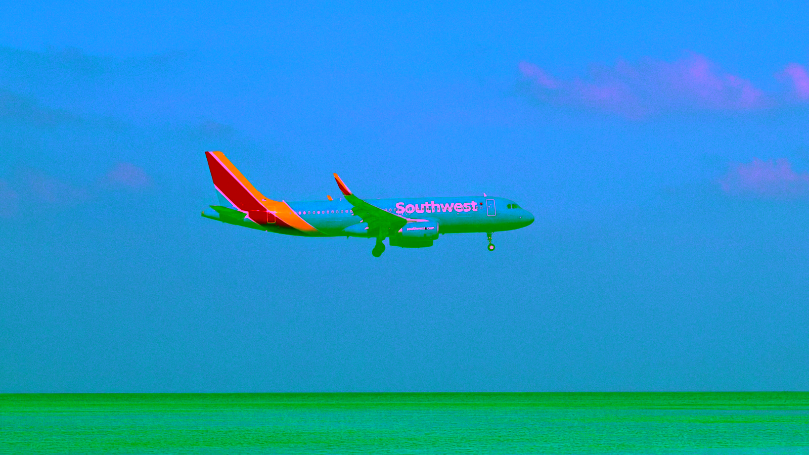 Southwest Airlines airplane flying over ocean
