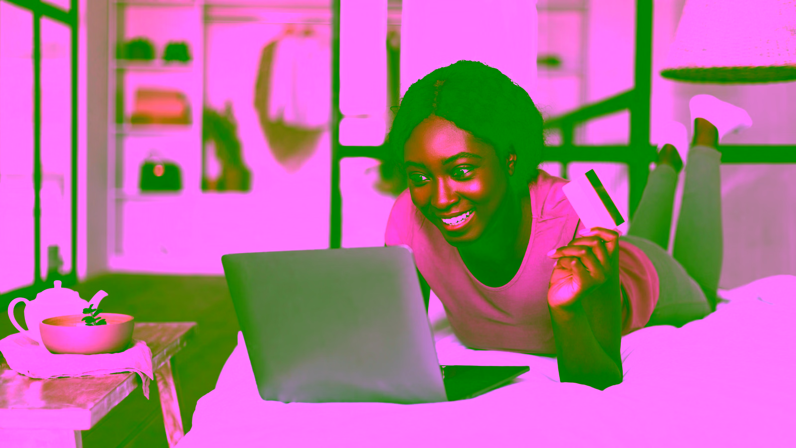 Woman shopping online with laptop and credit card