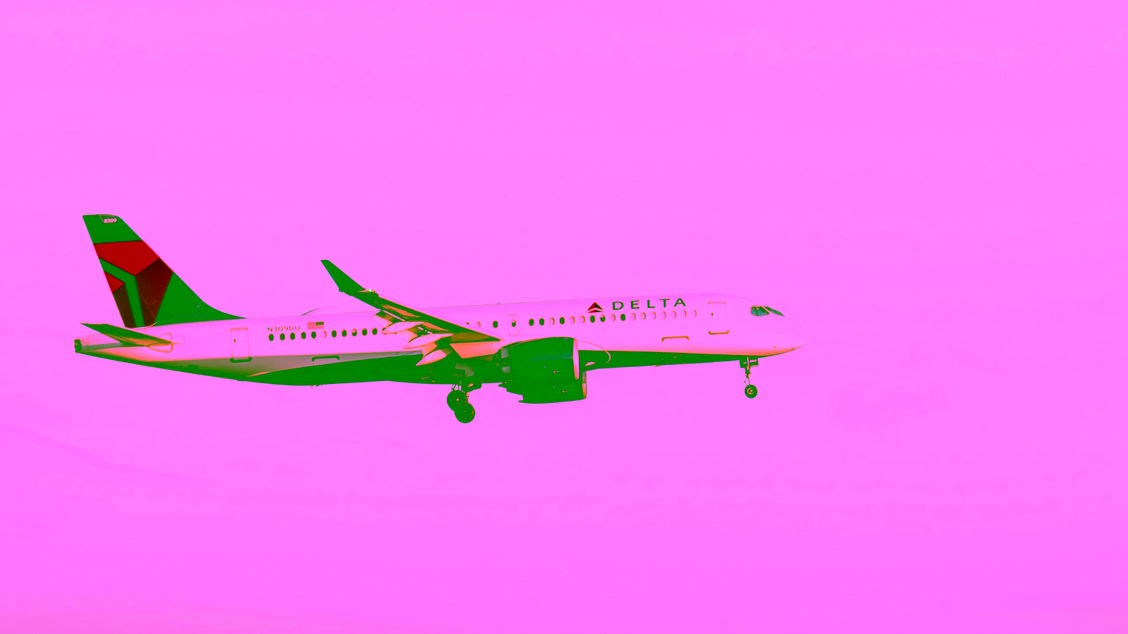 Delta Air Lines airplane landing with clear sky background