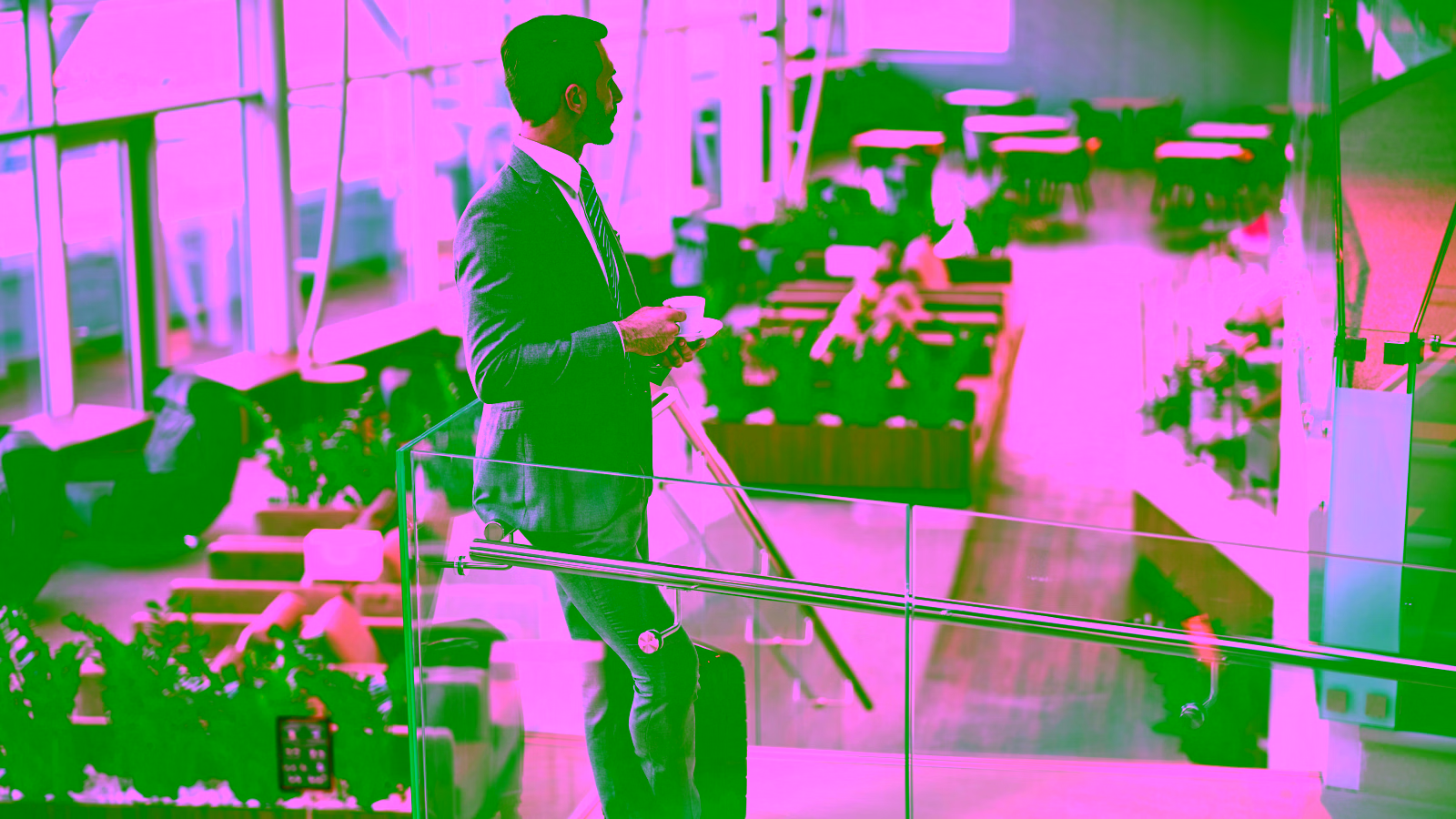 Business traveler relaxing in airport lounge with coffee