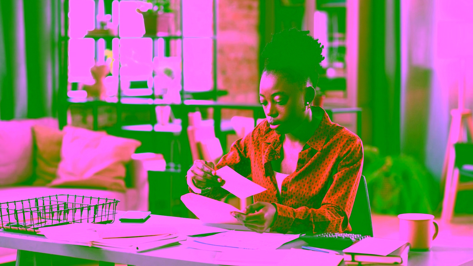 Person paying utility bills at home desk