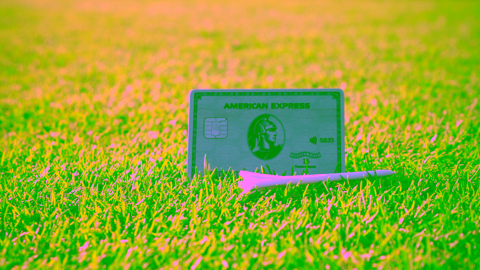 American Express Platinum card on grass with golf tees