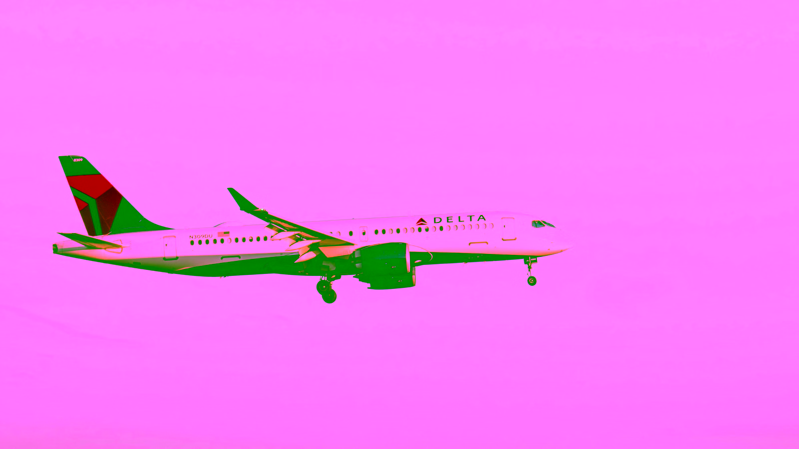 Delta Air Lines aircraft in flight at sunset