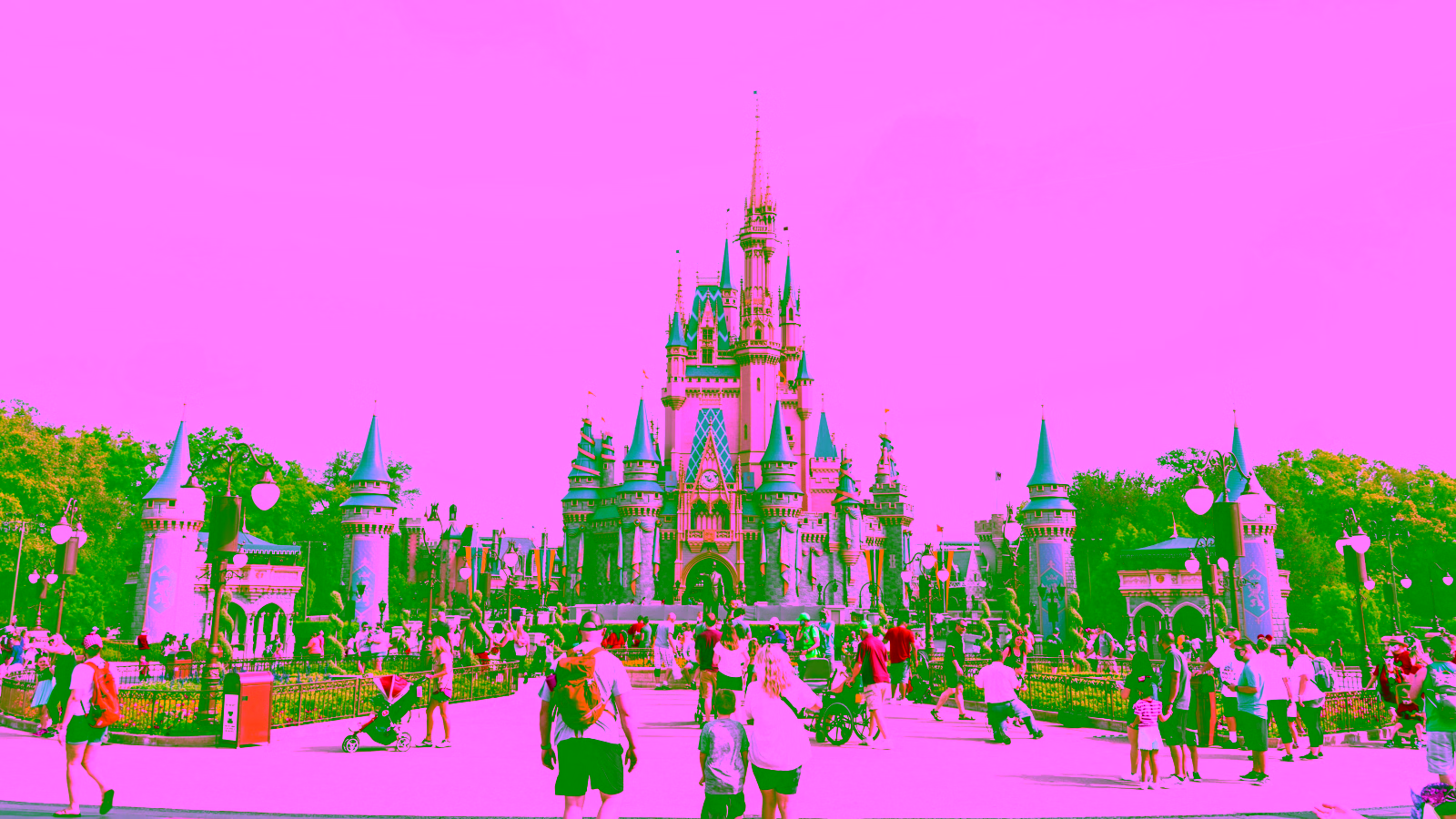 Cinderella Castle at Disney’s Magic Kingdom with visitors in the foreground.