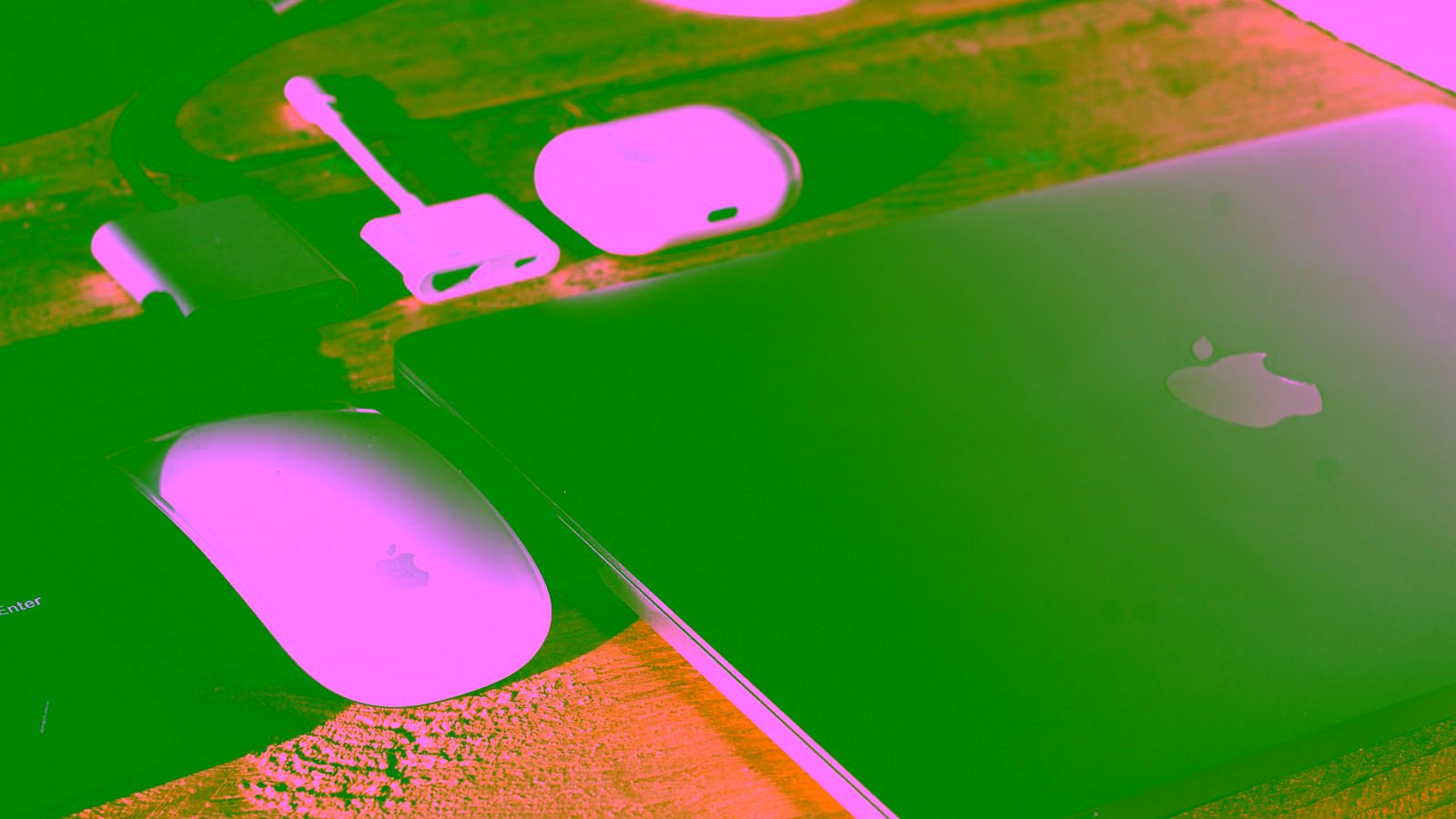 Apple laptop and accessories on desk