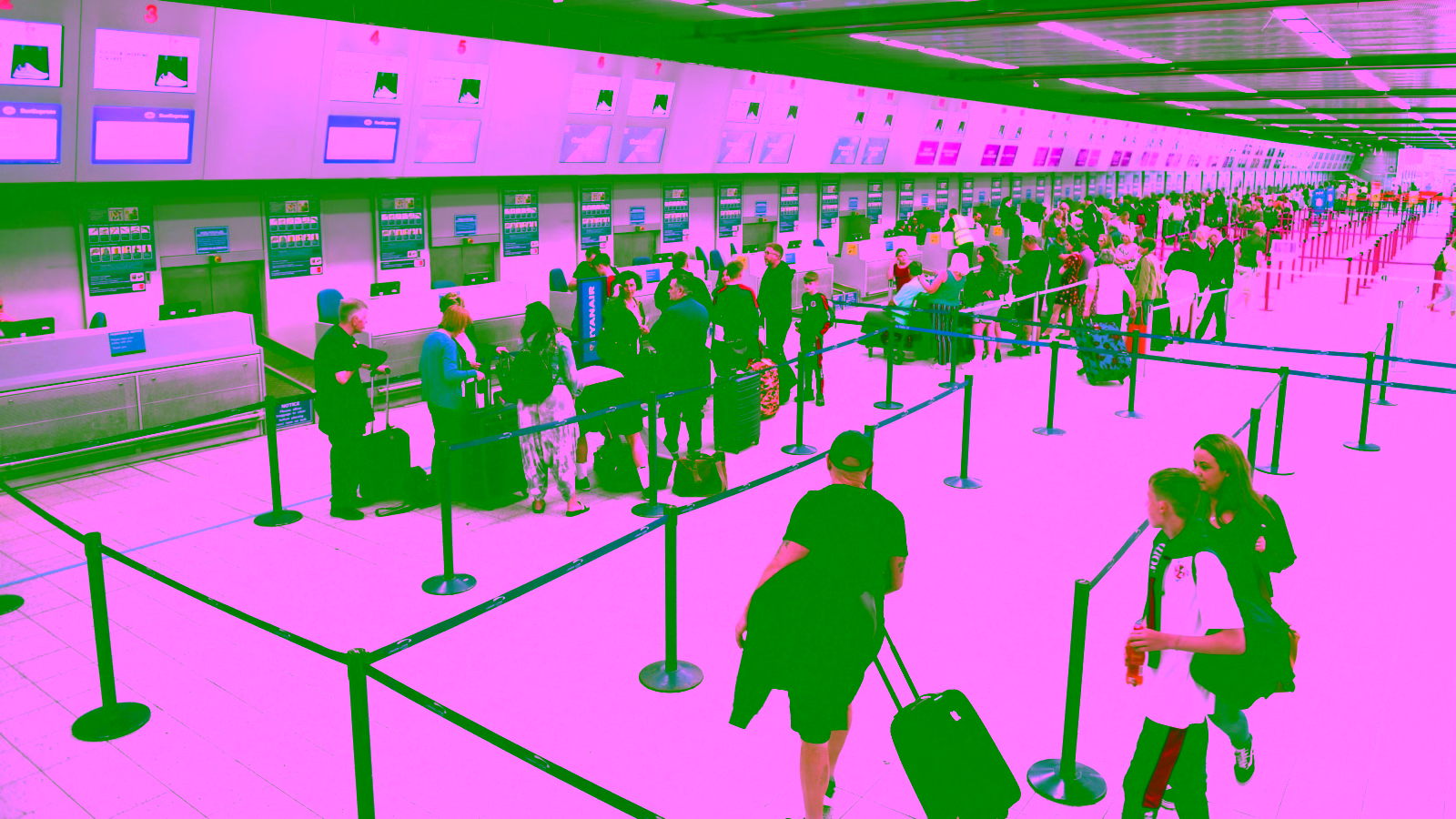 Travelers at airport check-in terminal