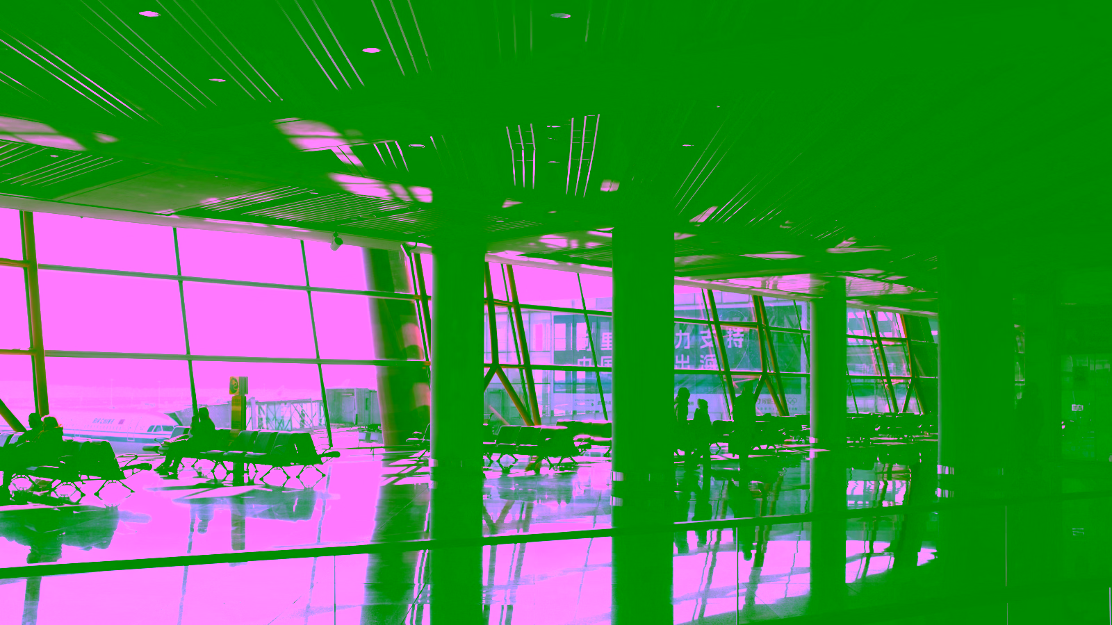 Airport terminal interior with large windows and waiting area