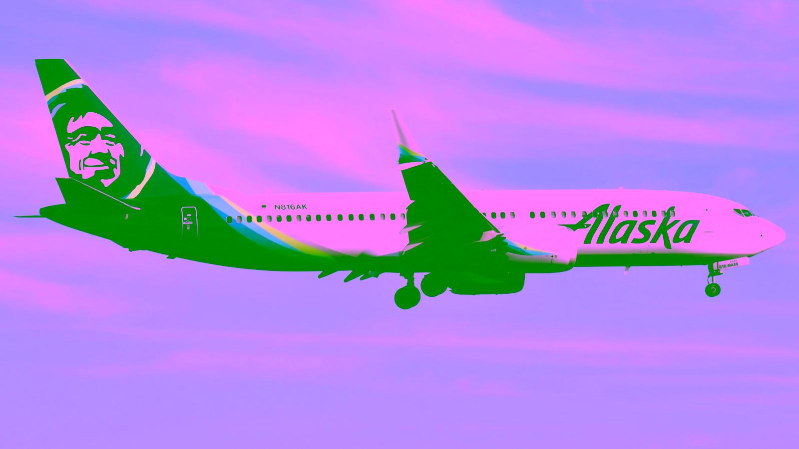 Alaska Airlines plane flying in the sky