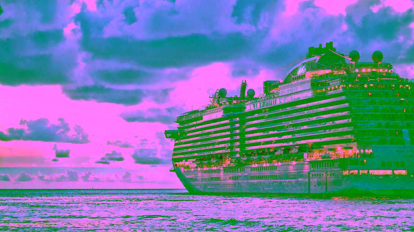 Cruise ship sailing at sunset under cloudy skies