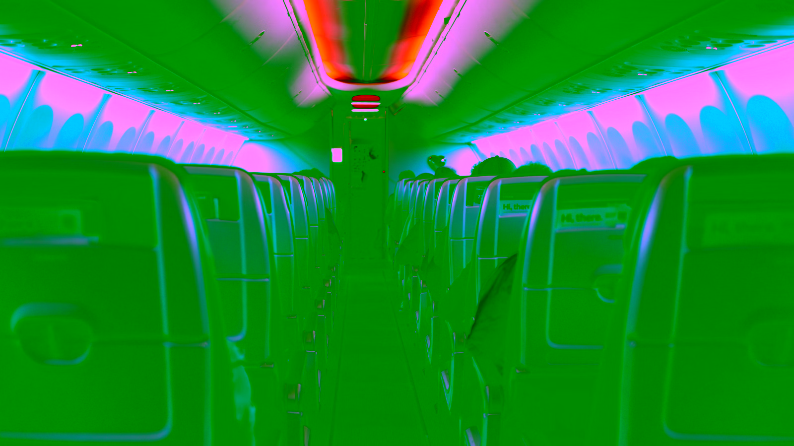 Airplane cabin interior with blue ambient lighting