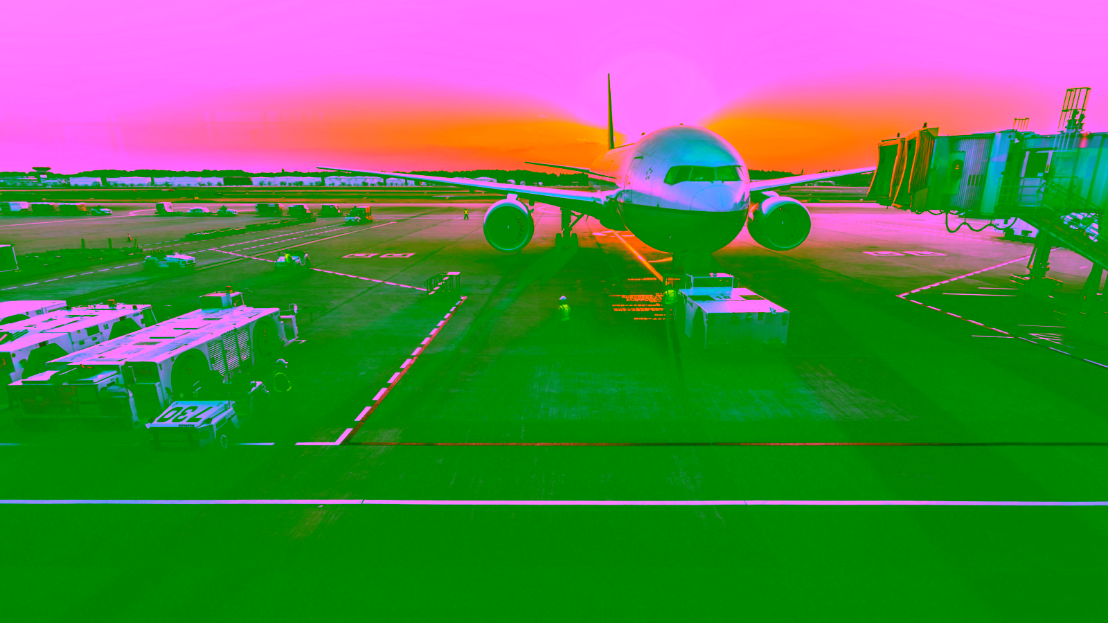 Airplane at airport during sunset