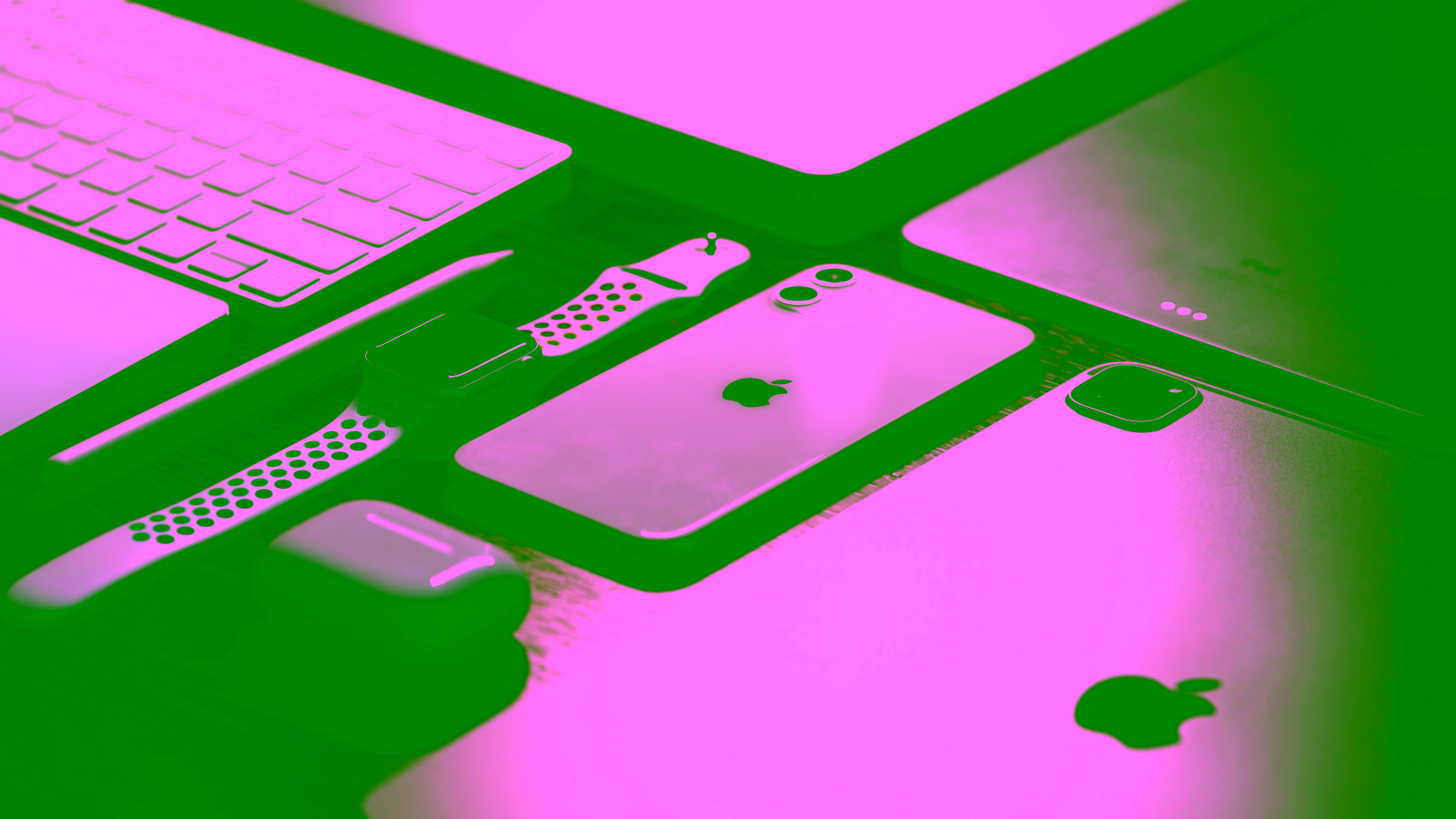 Apple devices on desk workspace