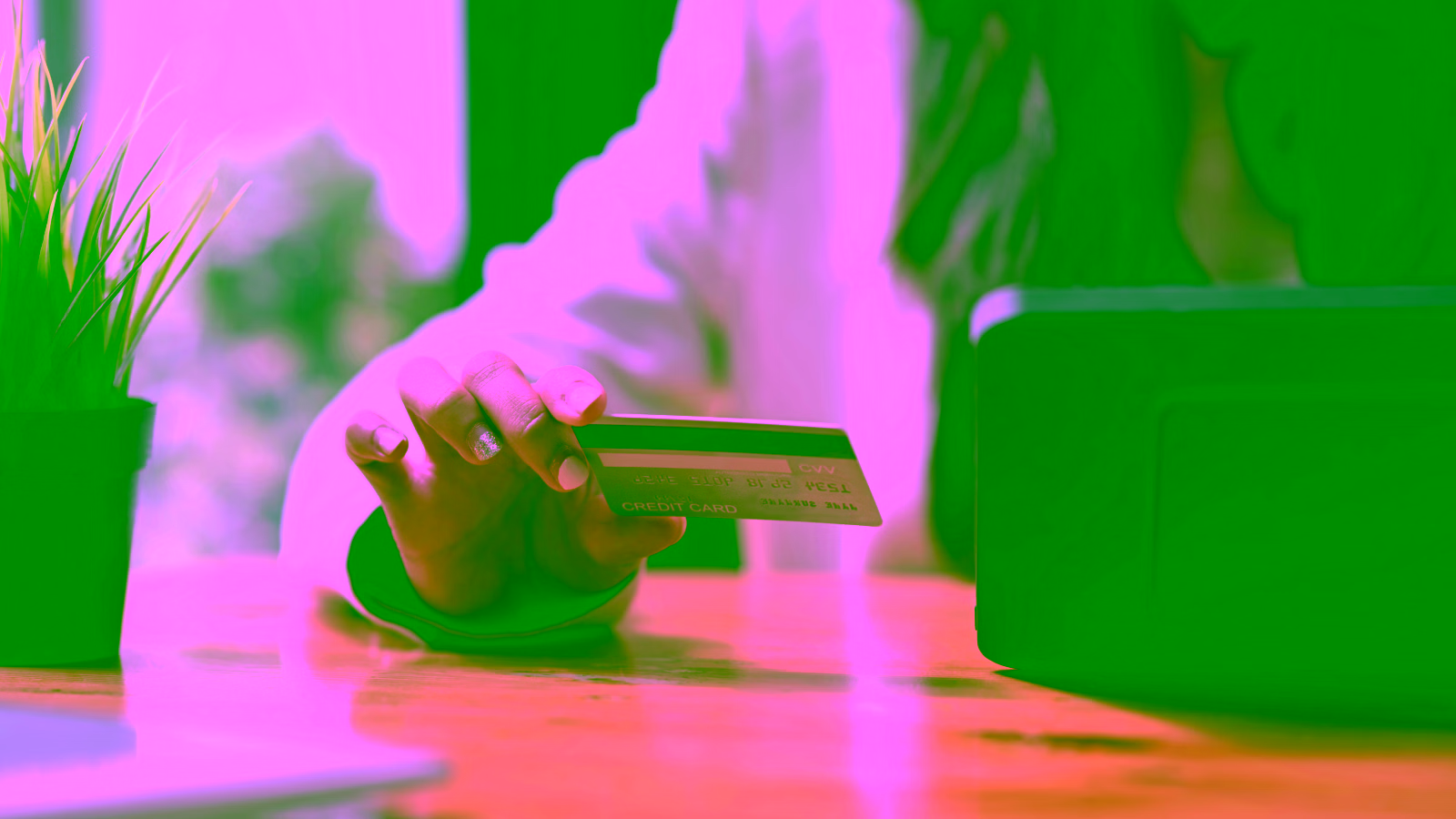 Person using a credit card for an online payment