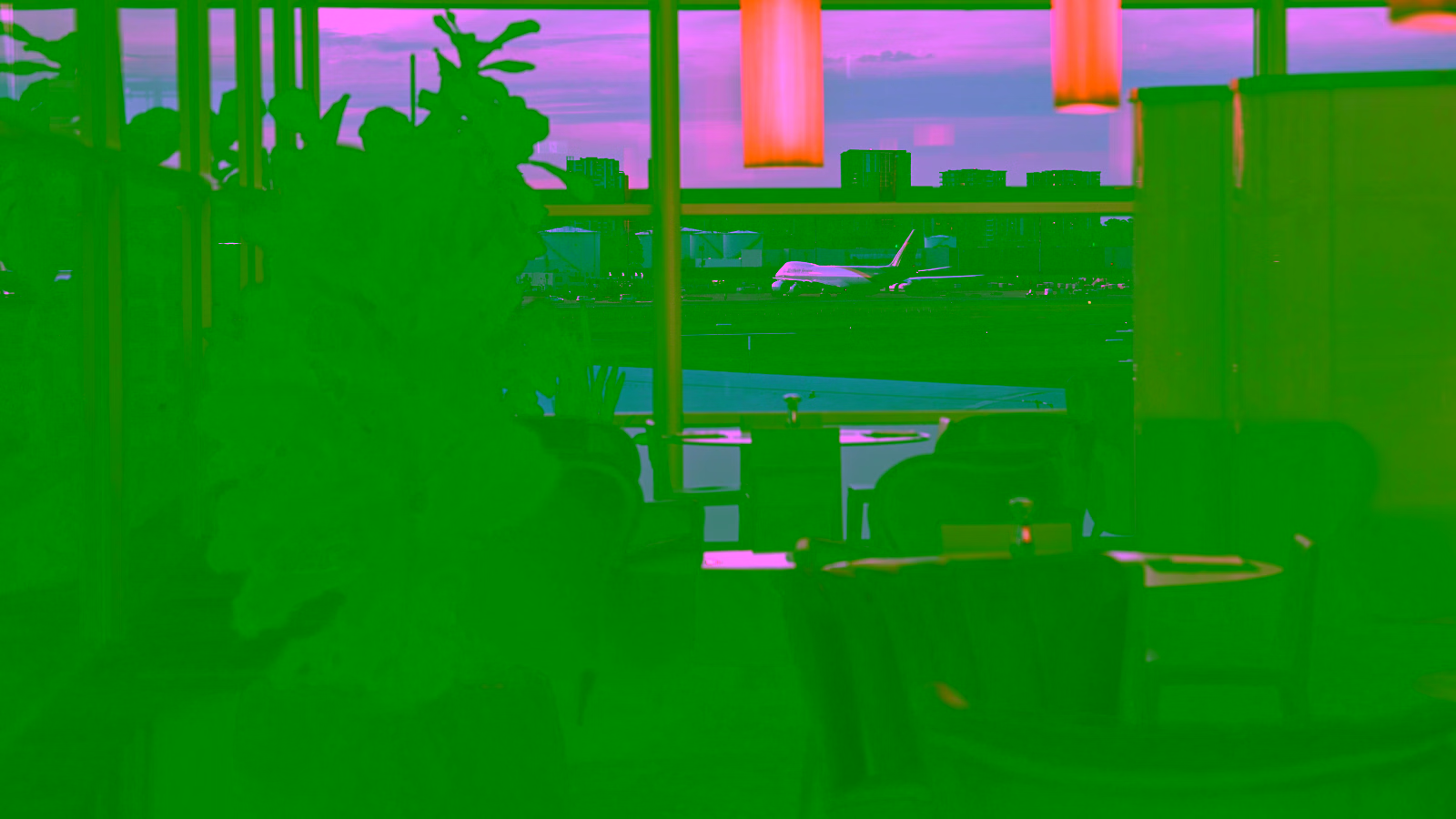 Airport lounge overlooking runway and aircraft