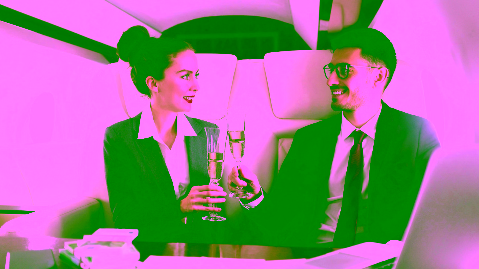Private jet passengers enjoying champagne