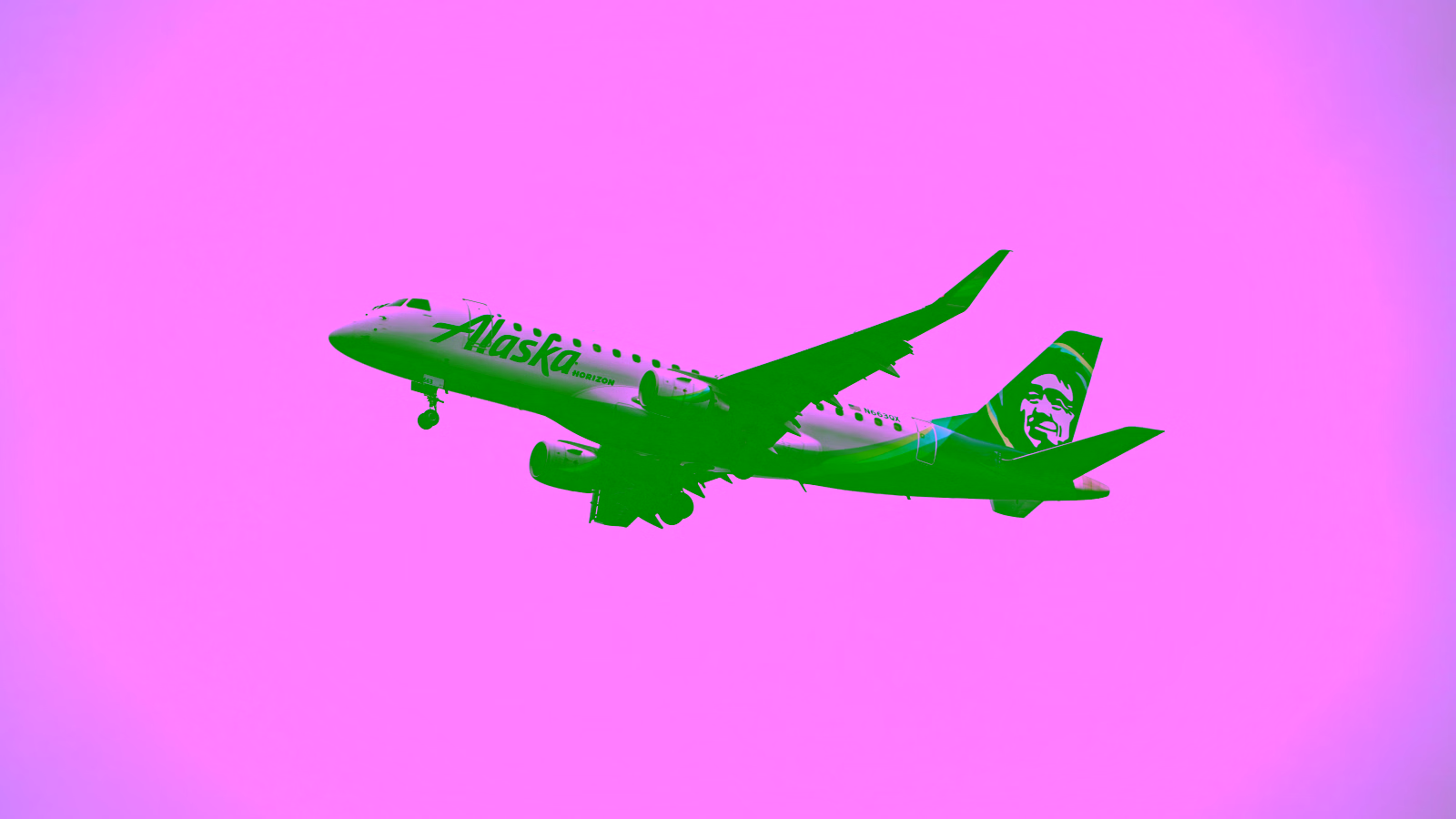 Alaska Airlines plane taking off into a cloudy sky