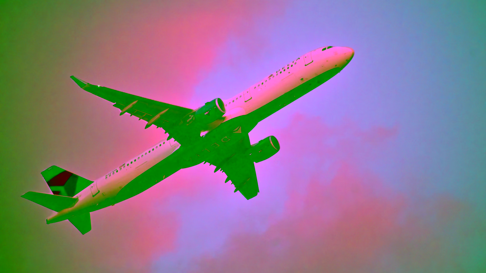 Delta Air Lines airplane taking off at sunset