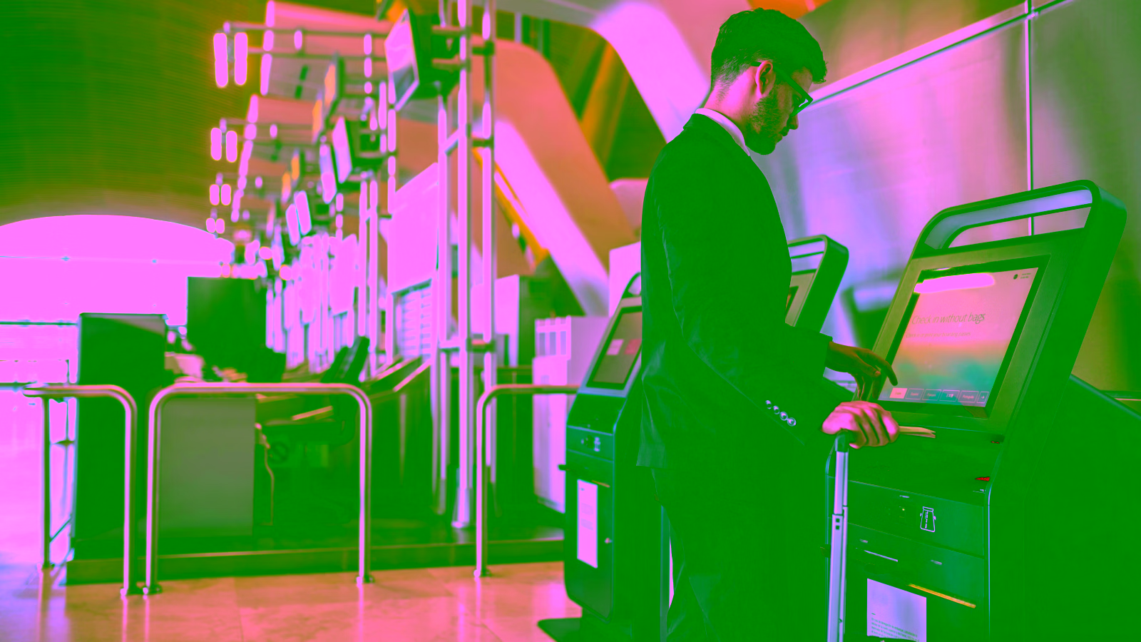 Traveler using airport self-service kiosk