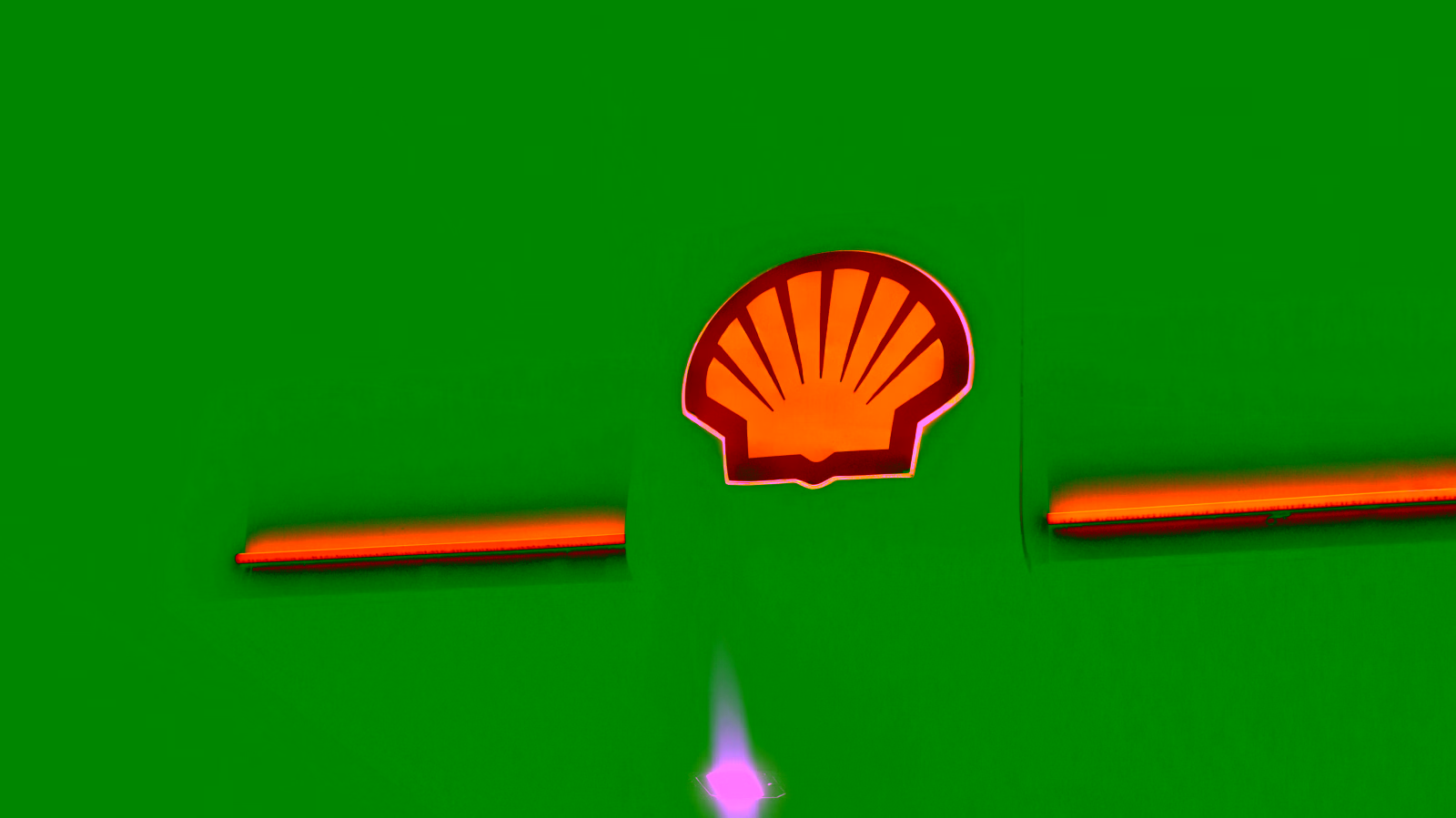 Shell gas station logo at night