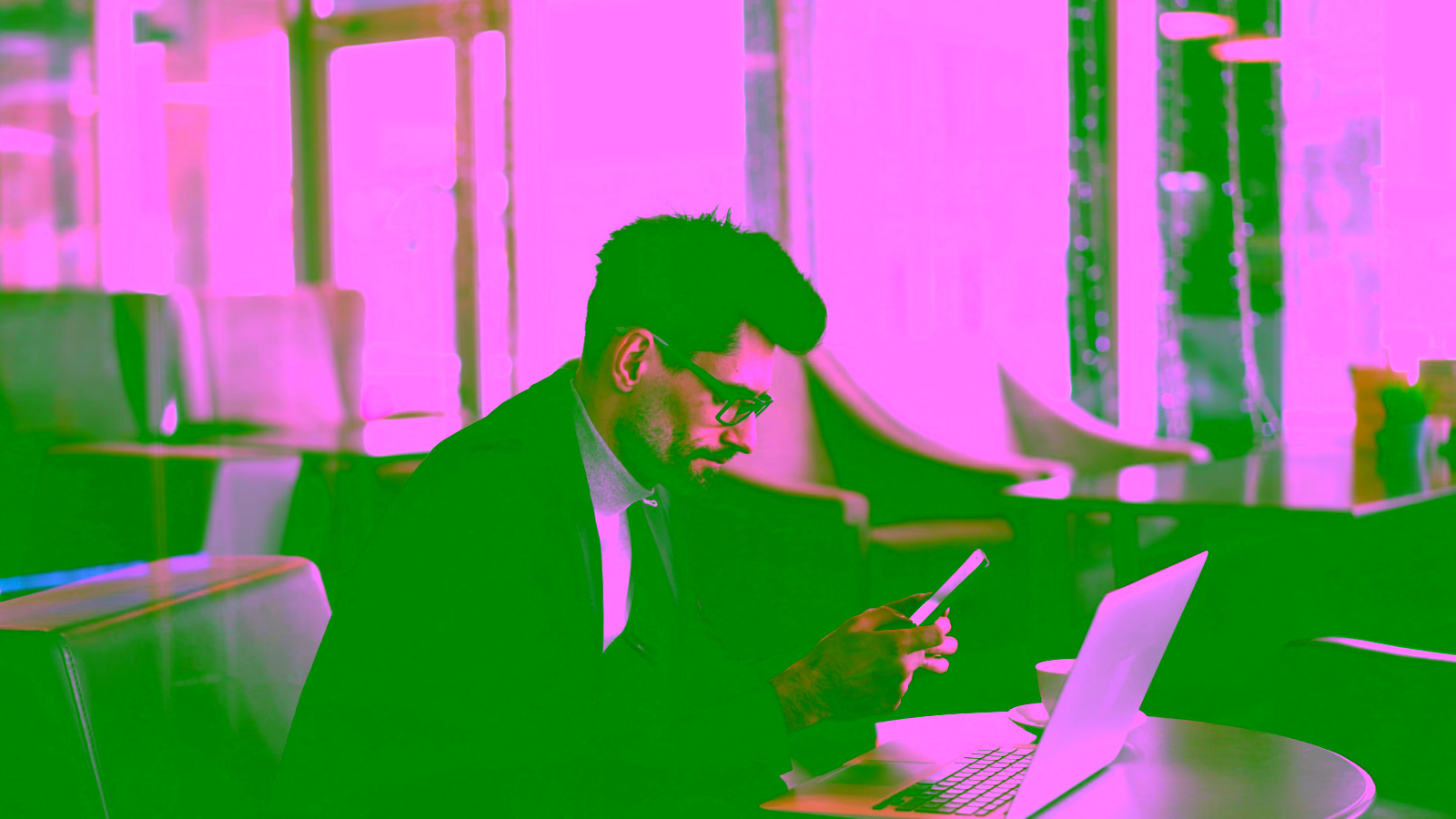 Business traveler using laptop and smartphone