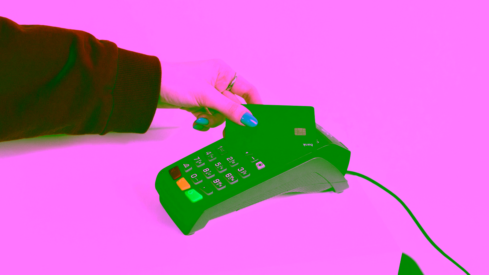 Person tapping a credit card on a payment terminal