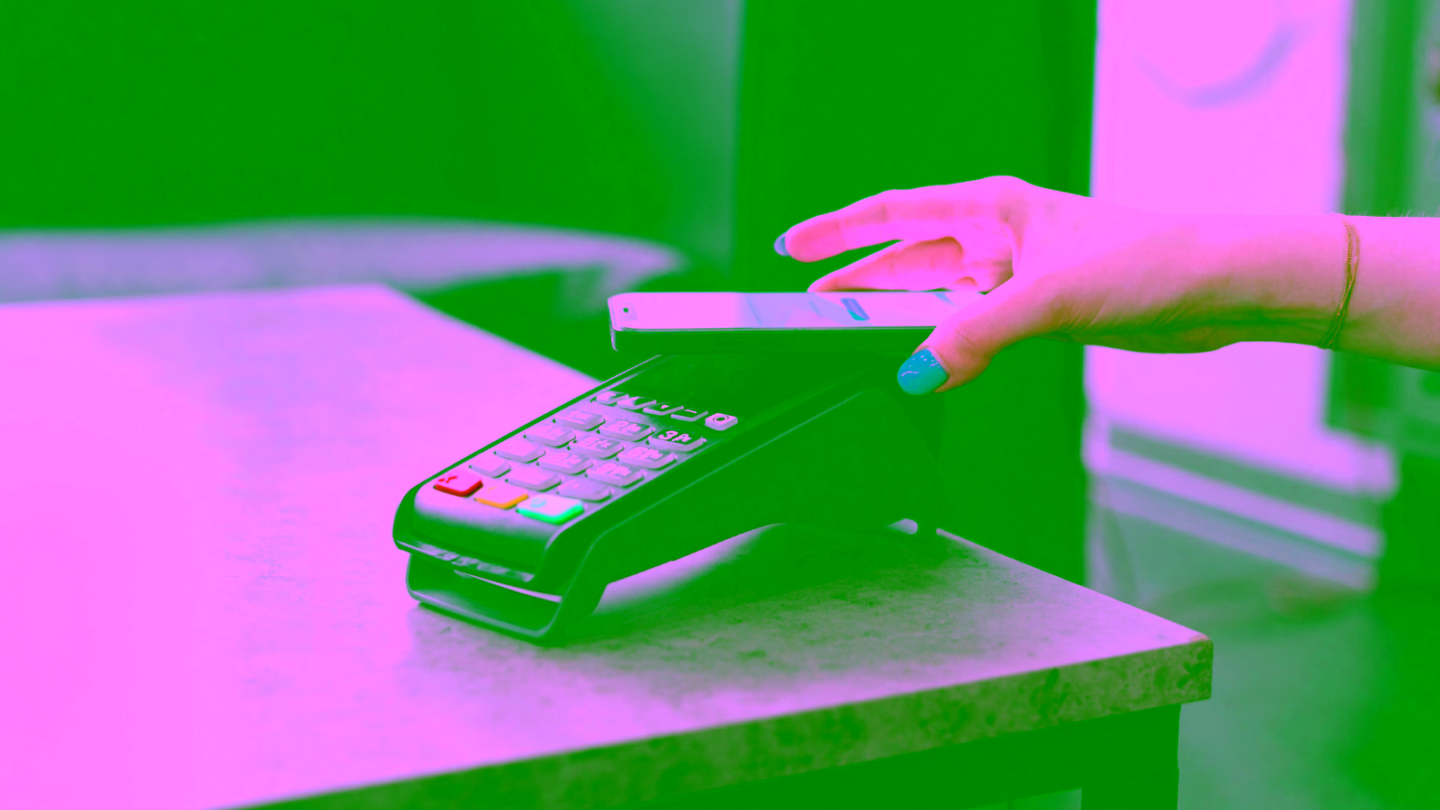 Person making a contactless payment with a smartphone