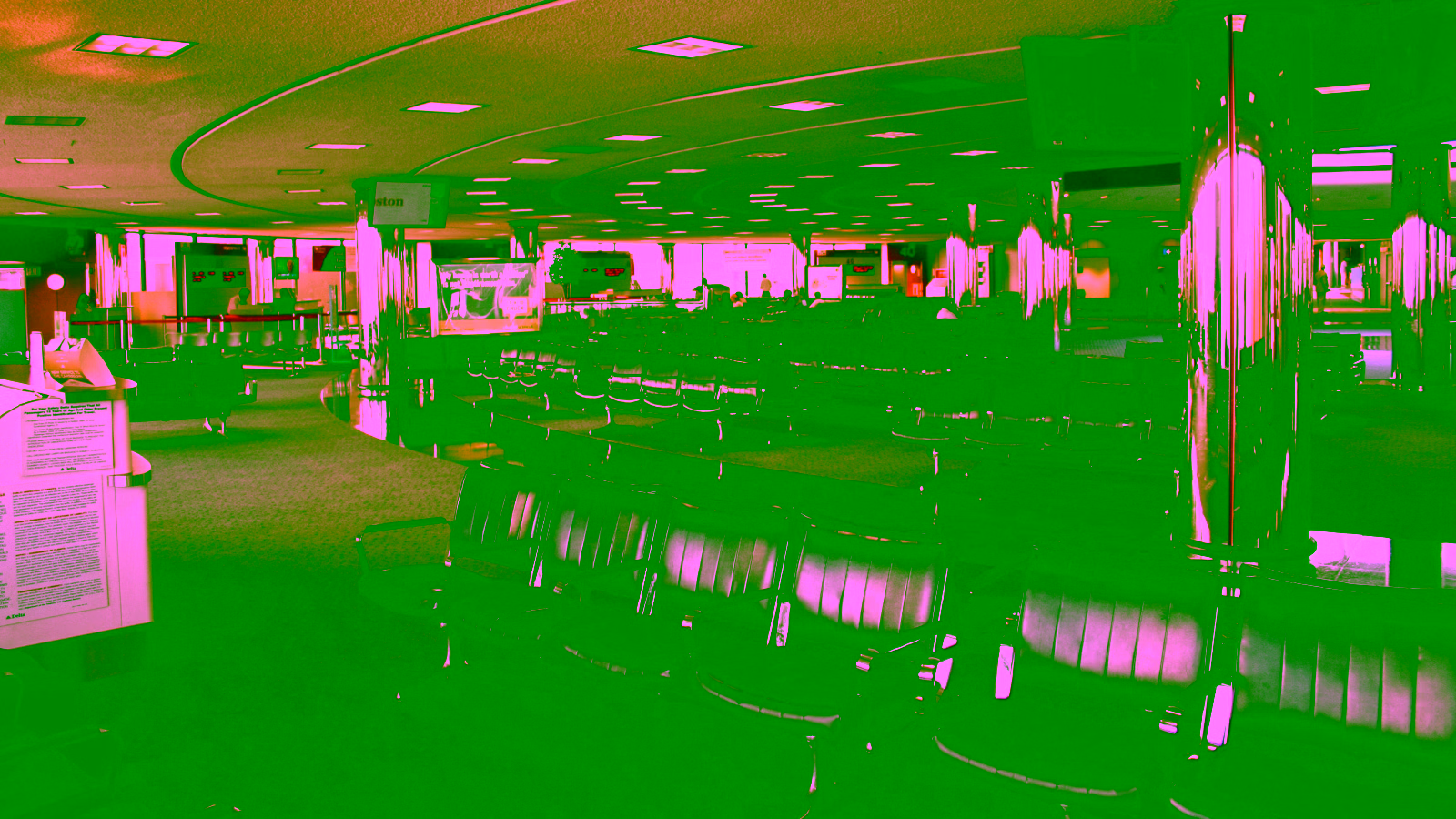 Airport terminal waiting area with empty seating