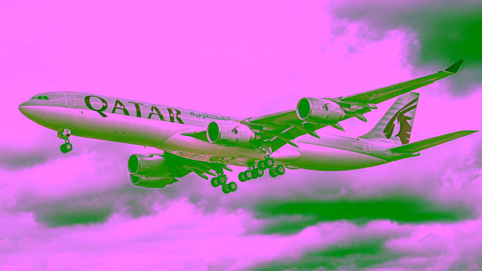 Qatar Airways aircraft landing with landing gear deployed