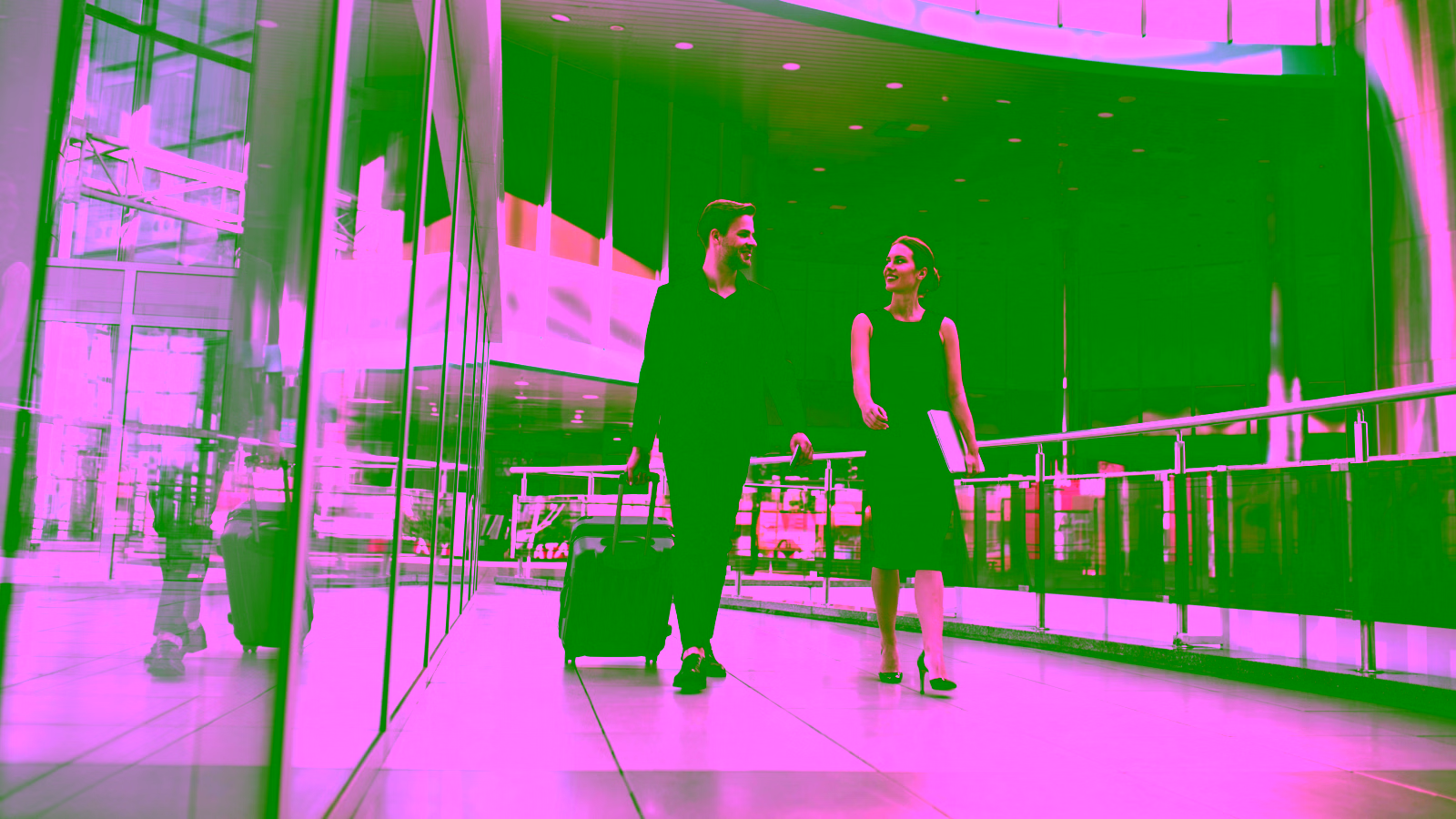 Business travelers walking through an airport terminal