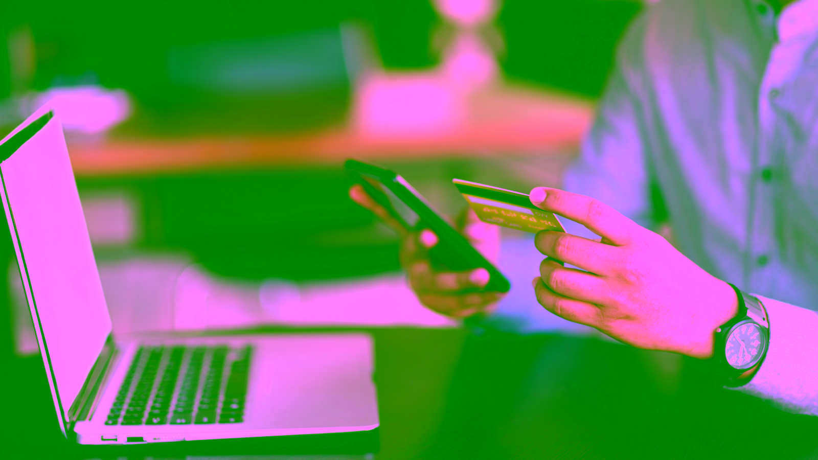 Person using a smartphone and credit card for online payment