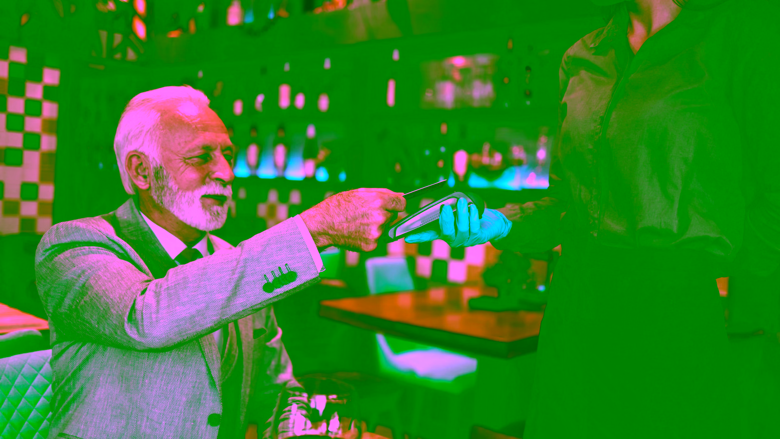Customer paying with a card at a restaurant