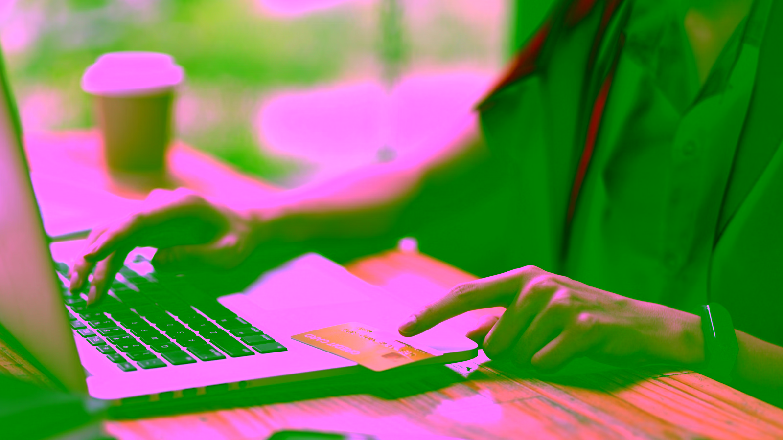 Person using a credit card for an online purchase