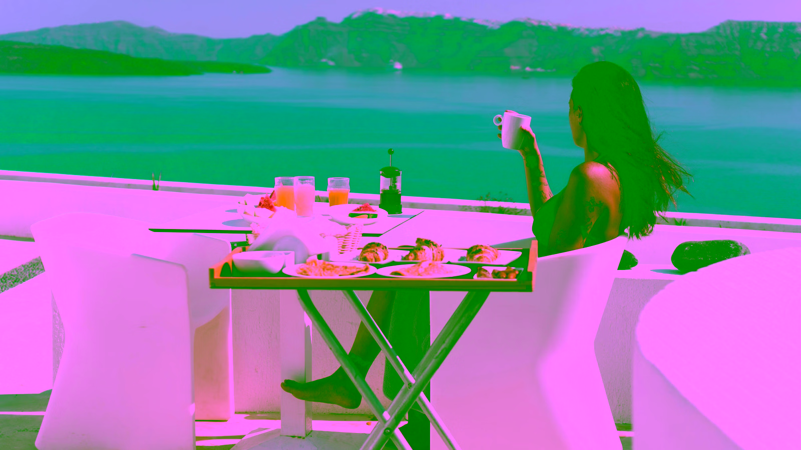 Woman enjoying breakfast with an ocean view