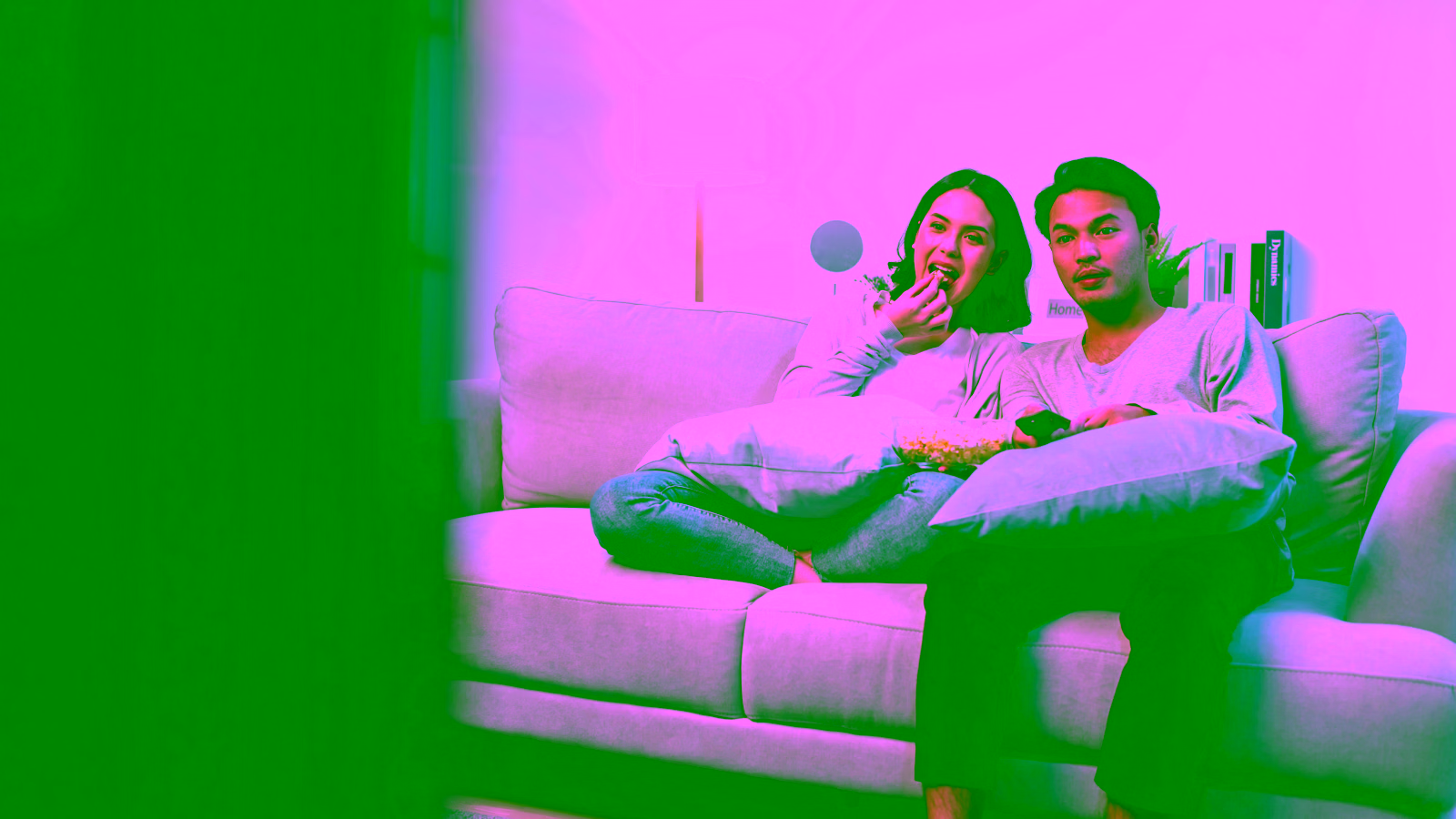 Couple watching TV together on a couch