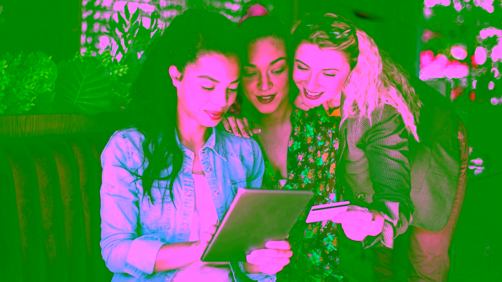 Friends shopping together with a credit card