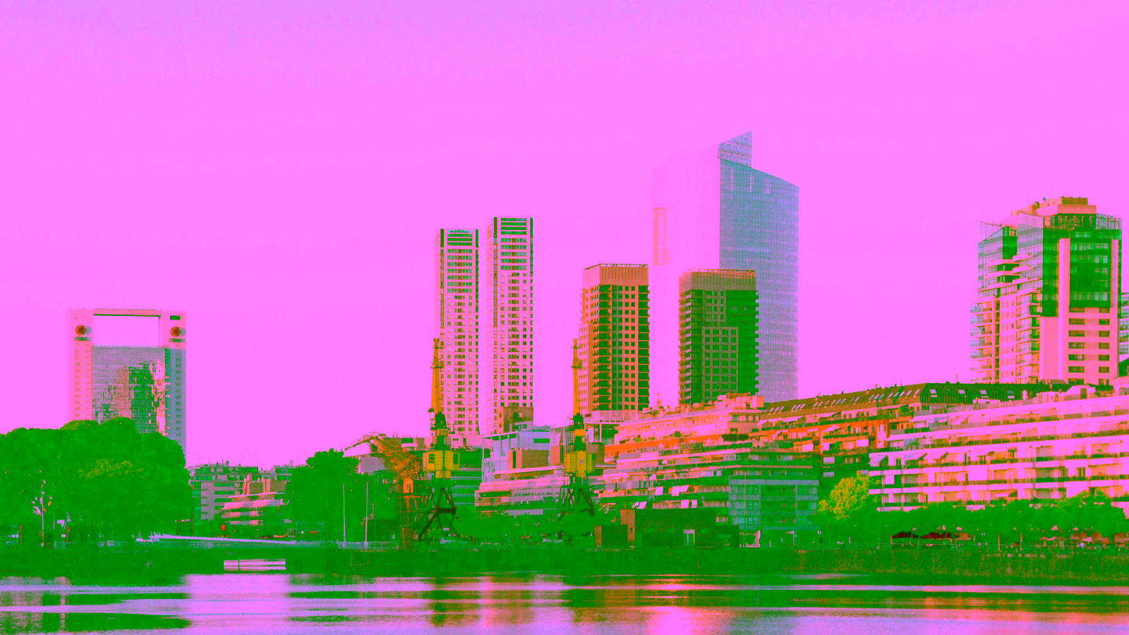 City skyline and waterfront at sunset